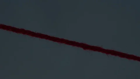 Red string of yarn being cut, closeup Stock Footage 82809502