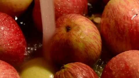 Red-striped apples is washed Stockbeeldmateriaal 328643607