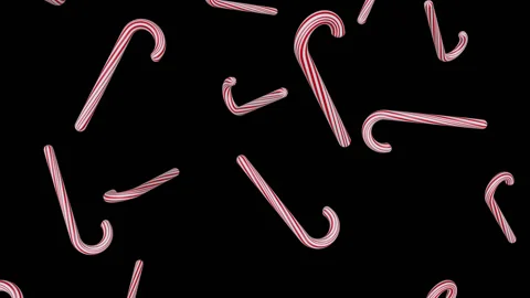 Red Striped Candy Canes Falling Seamless Loop with Alpha Matte Stock Footage 143534614