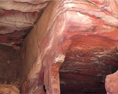 Red striped cliffs of Jordanian mountains, in which dwellings are hollowed Stock Footage 124841448