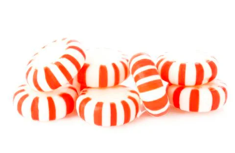 Red striped peppermints on a white Stock Photos