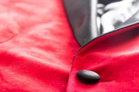 Red stylish jacket with buttons, background. Stylish clothes, macro, elegant Photos