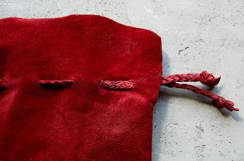 Red suede, leather bag. Handiwork. For runes, cards. Stock Photos