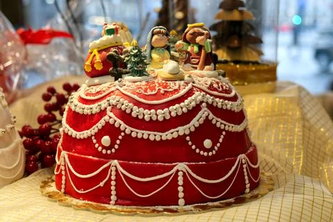 Red sugar paste cake decorated with crib puppets Stock Photos