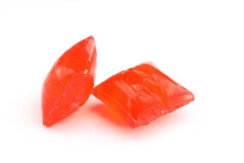Red sugar on a white background. Ramadan Feast candy. Stock Photos