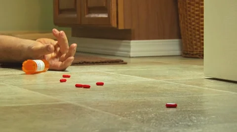 Red Suicide Pills Fall from Dead Hand 1 Vídeo Stock 8537788