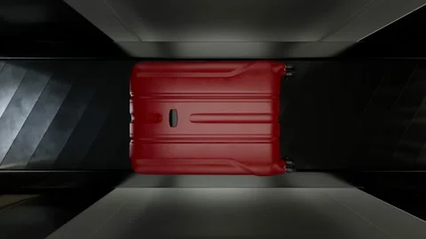 Red suitcase inside an airport scanner on a conveyor belt. Scanning process. Stock Footage 201223734