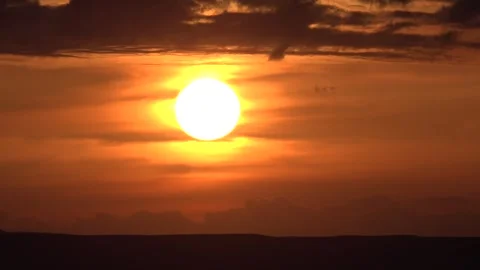 Red sun dusk above Libya cloud layers fiery evening glow evening weather detail Stock-Footage 339571148