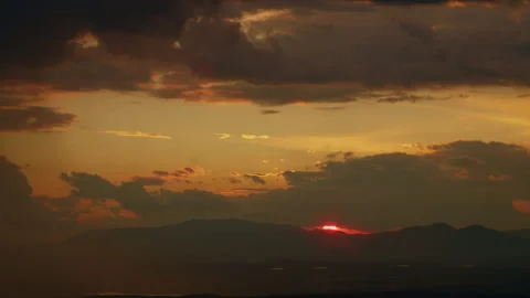  Red sun hides behind the mountain Video stock 161468704