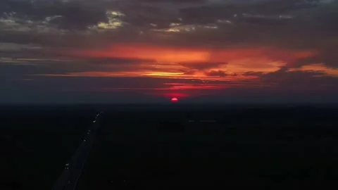 The red sun is hiding behind the horizon Stock Footage 211811548