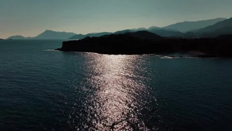 Red sun rising through the mountains Stock Footage 240483594