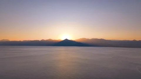 Red sun rising through the mountains Video stock 240483833