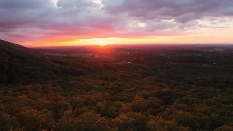 Red Sun Sets Behind Lush Hills At Dusk. Aerial Perspective Of Twilight 스톡 동영상 331121102