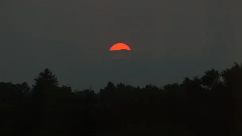 Red sun sets over smokey mountain Stock Footage 93667115