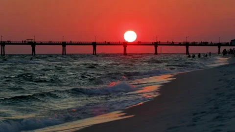 Red sun setting over pier in Fort Walton Beach Stock Footage 146073146