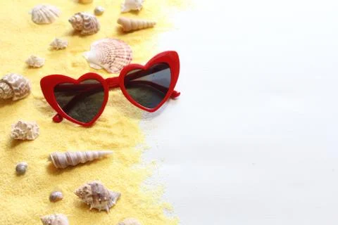 Red sunglass and shells Stock Photos