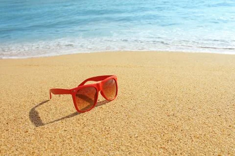 Red sunglasses on the beach Stock Photos