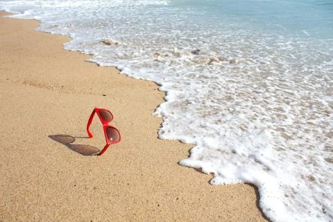 Red sunglasses on the beach Stock Photos