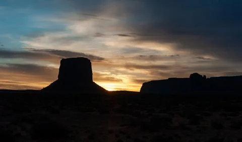 Red sunset against the backdrop of red sandstone rocks, Monument Valley, Ar.. Stock Photos