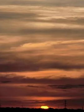 Red Sunset Beneath Dramatic Evening Clouds Stock Photos