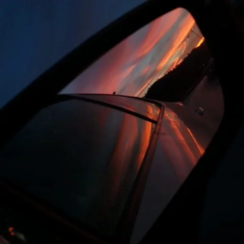 Red sunset Central red sky From a car mirror perspective Stock Footage