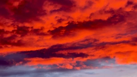 Red sunset with dark red clouds. Dramatic sky. Stock Footage 237116123
