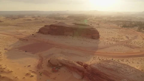 Red sunset, flare, desert with rocks. Al Ula Saudi Arabia. 4K Aerial. Sunflare. Stock Footage 196836807