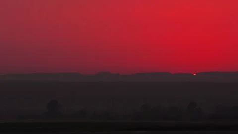 Red sunset, hilly horizon Stock Footage 285657961