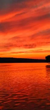 Red sunset on lake Stock Photos