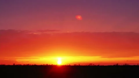 Red sunset in nature 4k. Sunset over field Video stock 178122025