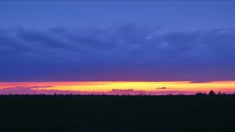 Red sunset in nature 4k. Sunset over the timelapse field Stock Footage 178122419