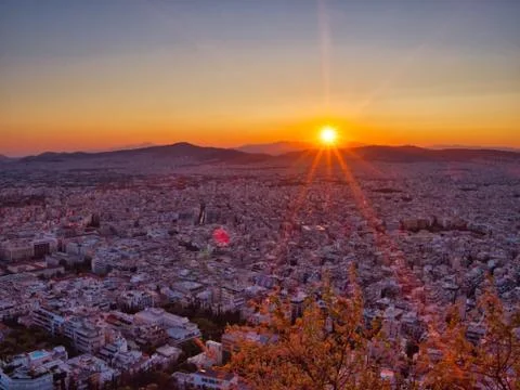 Red sunset over Athens with clear sky Stock Photos