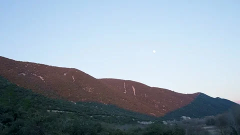 Red sunset over the forest hills of Saint-Léger-du-Ventoux, France Stock Footage 240436483