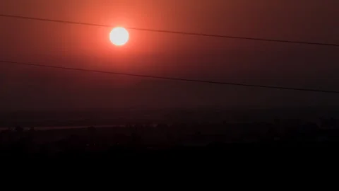 Red Sunset Over Mountains With Atmospheric Haze Stock Footage 337066354