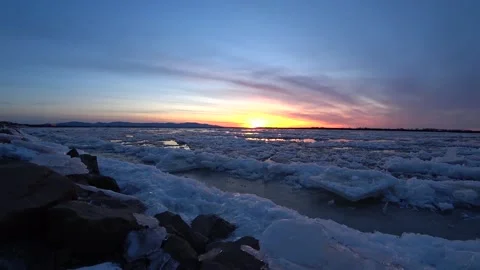 Red sunset over the running ice of a large river. Stock Footage 147346832