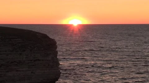 Red sunset over the sea, cliff Stock Footage 145849688