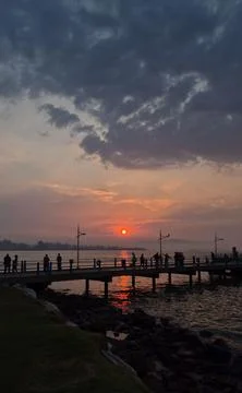 Red sunset on a pier Stock Photos