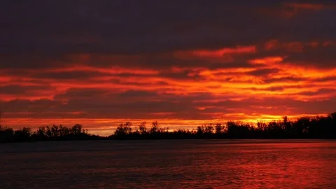Red sunset reflecting in the river Stock Footage 85401306