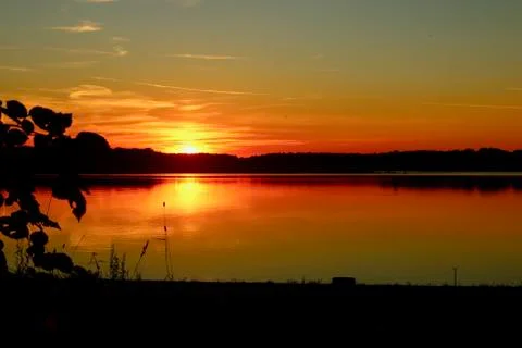 Red Sunset with reflection on the lake Stock Photos