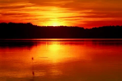 Red Sunset with reflection on the lake Stock Photos
