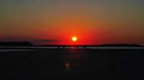 Red Sunset on Tybee Island Beach near Savannah Georgia HD Video stock 42762672