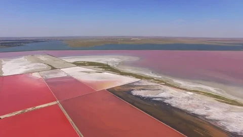 Red surface of salty lakes, aerial video Stock Footage
