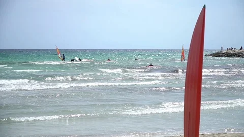 Red surfboard on the shore Stock Footage 128351866