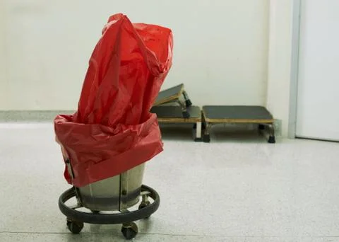 A red surgical garbage bin in operating room Stock Photos