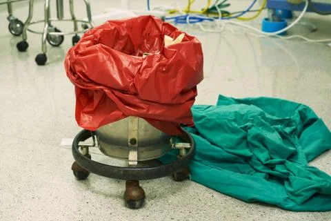 A red surgical garbage bin in operating room Stock Photos