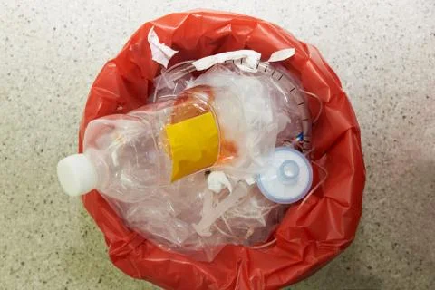 Red surgical garbage bin in operating room Stock Photos