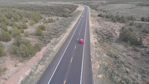 Red SUV Drives on Two Lane Highway, Desert, Arizona Stock Footage 146556049