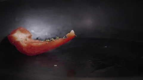 Red sweet peppers in pan Stock Footage 83205781