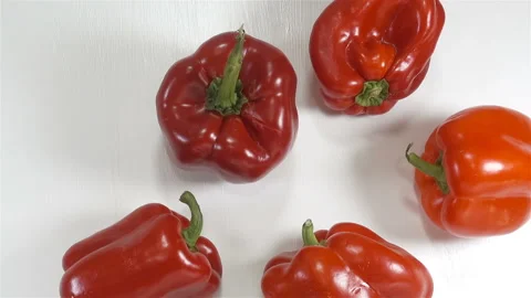 Red sweet peppers on white Stock Footage 139281116