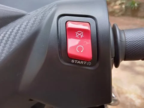 Red switch of a scooter Stock-Fotos